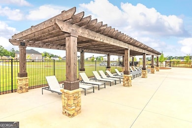 View of patio featuring a pergola