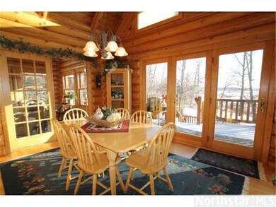 Dining area overlooks the lake and has access to t