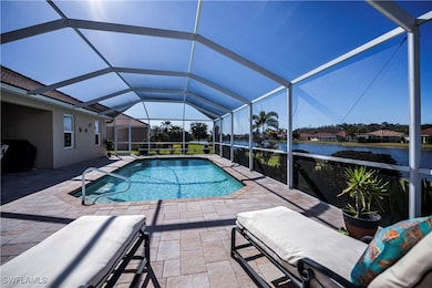 View of swimming pool featuring a lanai, a water view, and a patio