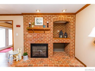 Beautiful brick fireplace that has been converted to gas.