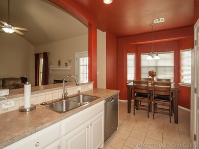 Kitchen has a great breakfast nook and is open to