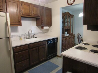 Kitchen has ceramic backslash and solid surface co