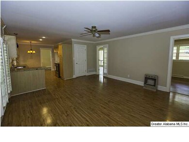 Family Room off of kitchen has plantation shutters