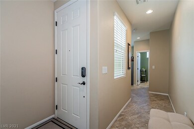 Front door and hall to the den