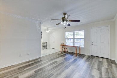 Impact windows, wood look laminate flooring.