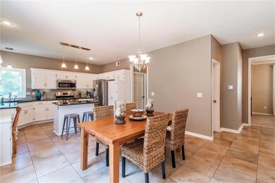 Spacious kitchen allows for plenty of seating.  Ea