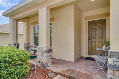 Charming Paved Front Porch with Exterior Stone Fac