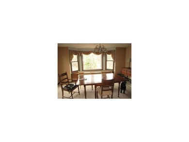 Formal dining room overlooks the back yard and abo