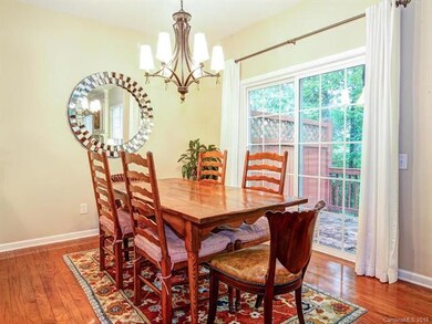 Dining room open to kitchen and sliding doors to b