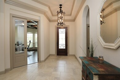 ARCHITECTURAL DETAILS:  From the tray ceiling to the crown molding and the substantial base molding, the attention to detail in the design of this home is evident.  French doors open to a private home office or study at the front of the house.