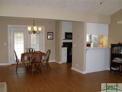 Looking into Dining Room Kitchen.  Breakfast Bar w