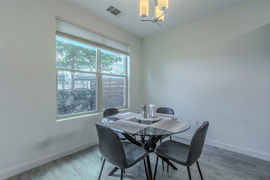 Dining space with a chandelier and wood finished 