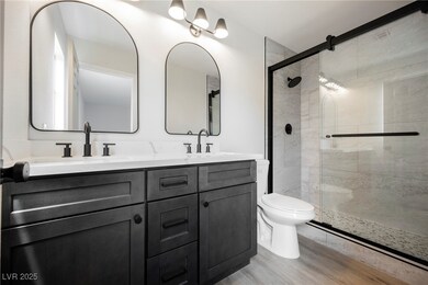 Full bathroom with toilet, wood finished floors, a