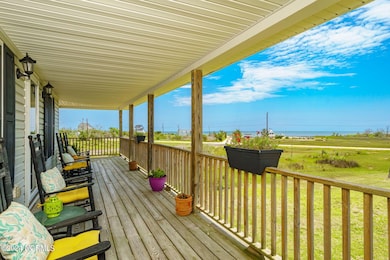 Covered wraparound porch w/ views
