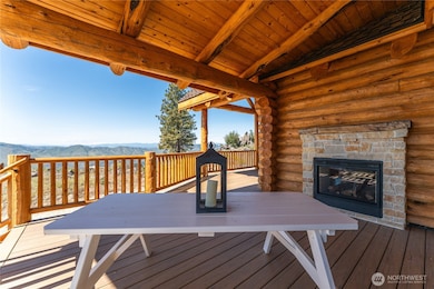 Exterior view of porch with double sided fireplace.