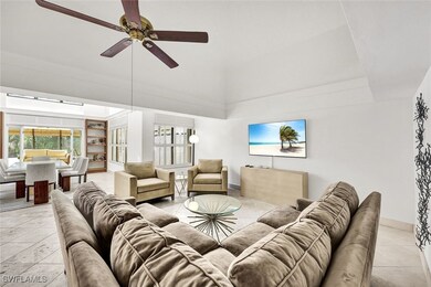 Living room with baseboards and ceiling fan