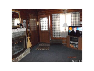 TV Room with Wood Burning Fireplace.