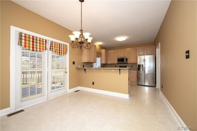 The kitchen is open to breakfast area and family r