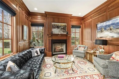 Beautiful study with mahogany style panel walls.
