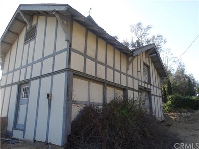 View from rear.  Main entrance.  Driveway takes yo