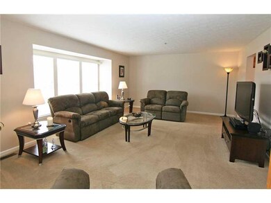 Living Room. Neutral dcor and plenty of natural li