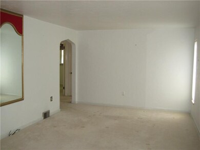 Living Room. Hardwood floors under carpeting. Long