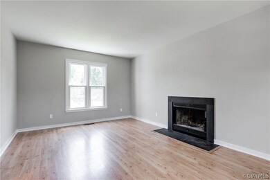 The family room has wood laminate flooring and a w