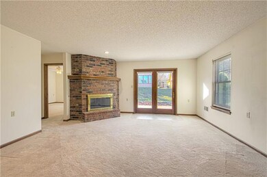 Corner fireplace, newer Anderson windows and atriu