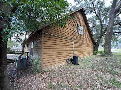 View of property exterior with a central AC unit