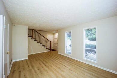Unfurnished room featuring a textured ceiling and 