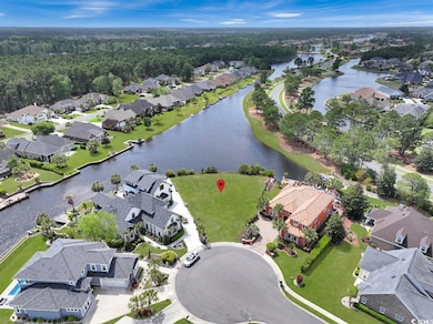 Drone / aerial view with a water view and a reside