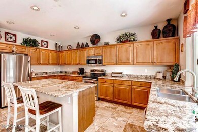 Spacious Kitchen with Granite & Bar