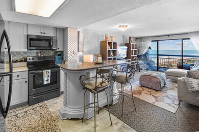 Kitchen featuring a breakfast bar area, gray cabin