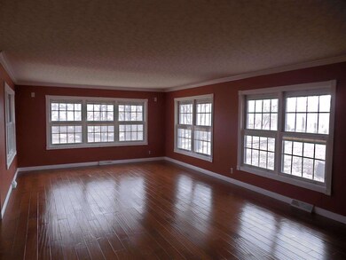 The spacious great room with crown molding offers 