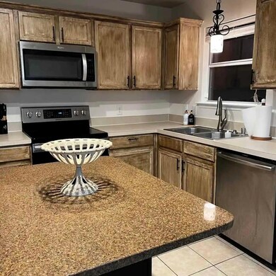 Kitchen featuring sink, appliances with stainless 