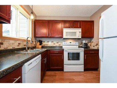 Nicely refinished cabinets and new lighting make t