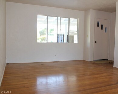 Entry way with hall closet, hardwood floors, light & bright living spaces.