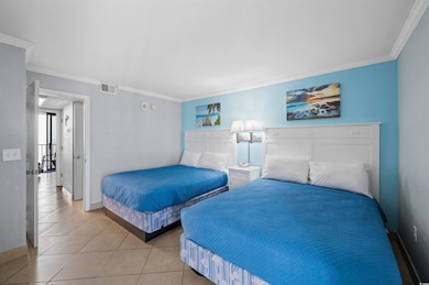 Tiled bedroom featuring ornamental molding