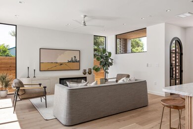 Living room with light wood-type flooring, ceilin