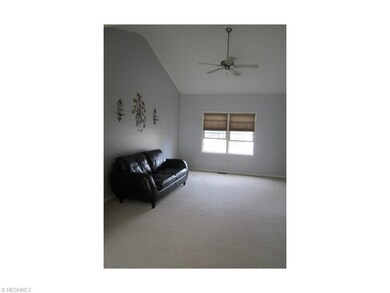 Vaulted Great Room with Neutral Carpet