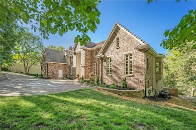 Estate sits on 1.175 acres with lots of trees and privacy. Slate roof, Hackett Stone front and heated driveway.