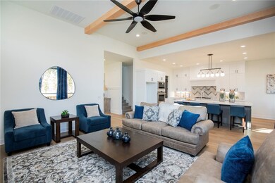 The open layout seamlessly connects the living roo
