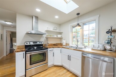 Updated Kitchen with Stainless Steel appliances and vent hood.