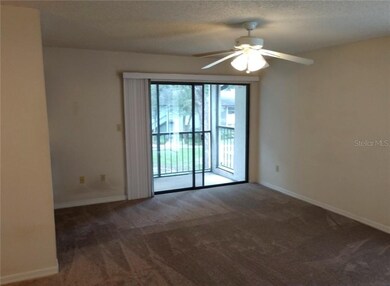 formal living room with view, patio and lockable s