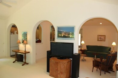 Arches into kitchen & living room from sun room. N