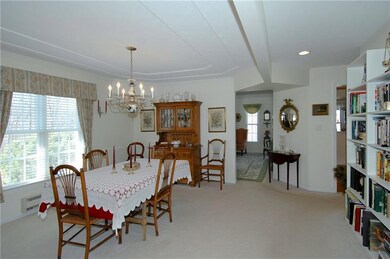 The dining room is sizable with a large window all