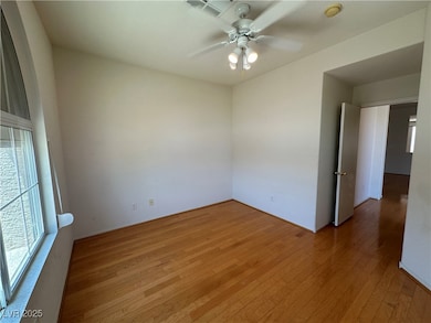 Spare room with light wood-type flooring, a ceilin