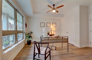 Office area featuring ceiling fan, a wealth of natural light, and light hardwood / wood-style flooring