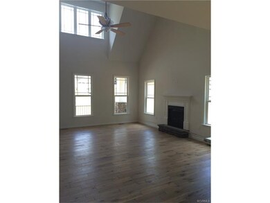 great room with soaring cathedral ceilings and gas
