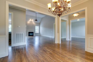 formal dining open to living and kitchen area